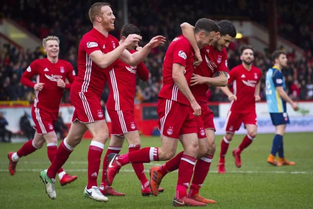 Aberdeen's Andrew Considine celebrates after making it 1-0. Picture: SNS/Bill Murray