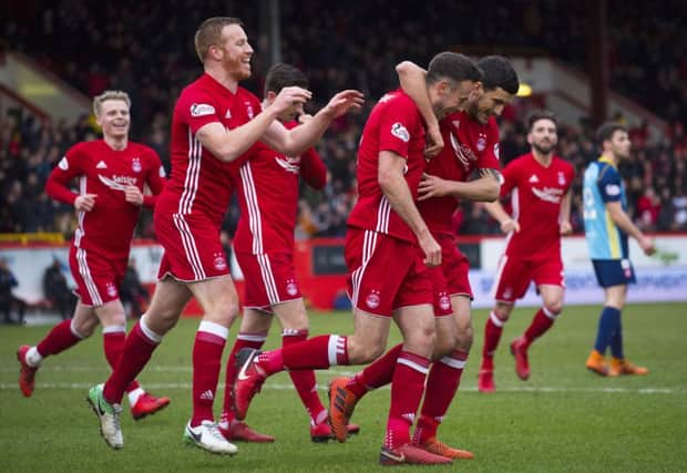 Aberdeen's Andrew Considine celebrates after making it 1-0. Picture: SNS/Bill Murray