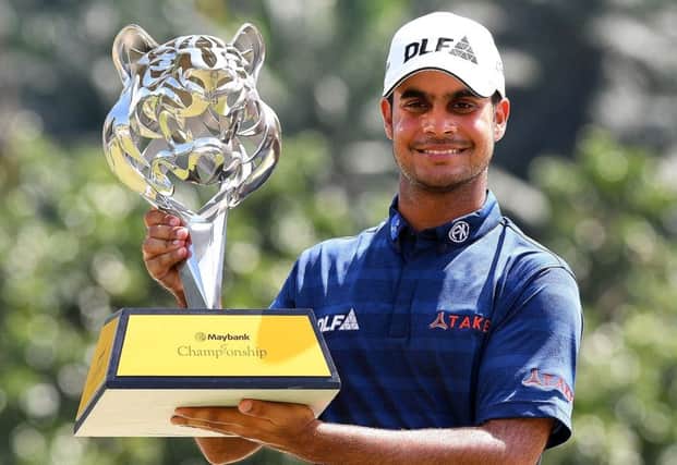 India's Shubhankar Sharma shows off the trophy after winning the Maybank Championship in Malaysia. Picture: Getty Images