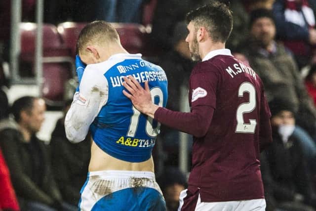 St Johnstone's David Wotherspoon is consoled by Michael Smith after being sent off. Picture: SNS