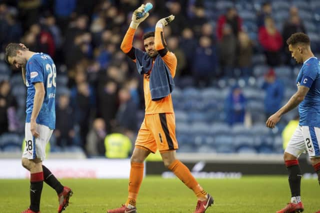 Rangers players trudge off the field after full-time. Picture: SNS