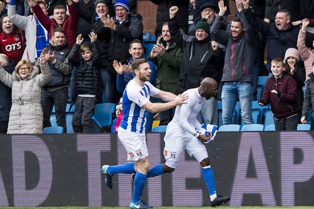 Youssouf Mulumbu runs to the Kilmarnock fans following his goal against Celtic which secured victory for Kilmarnock. Picture: SNS.