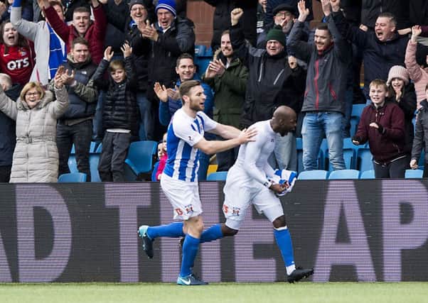 Youssouf Mulumbu runs to the Kilmarnock fans following his goal against Celtic which secured victory for Kilmarnock. Picture: SNS.