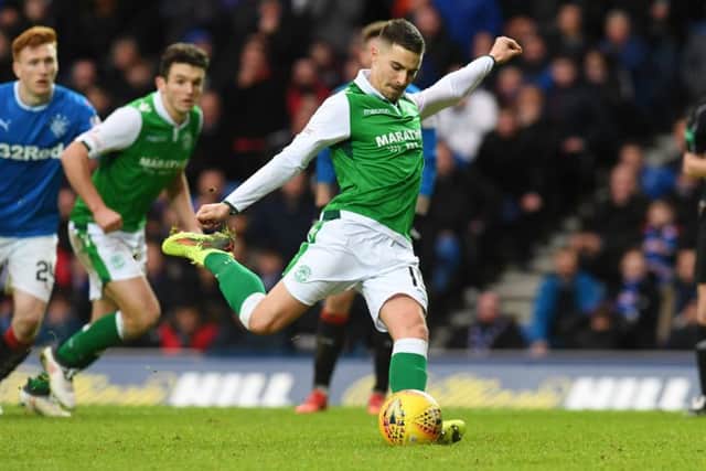 January recruit Jamie Maclaren prepares to blast Hibs' match-winning penalty at Ibrox. Picture: SNS.