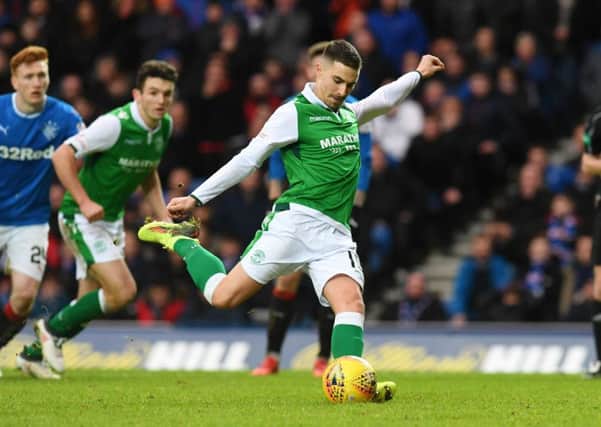 January recruit Jamie Maclaren prepares to blast Hibs' match-winning penalty at Ibrox. Picture: SNS.