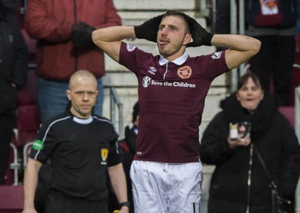 David Milinkovic celebrates scoring the goal which gave Hearts victory over St Johnstone. Picture: SNS.