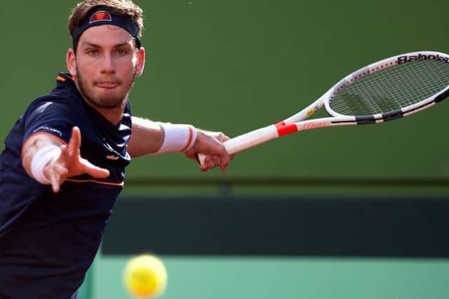British Cameron Norrie returns the ball to SpainÂ´s Spain's Albert Ramos during the first round of the Davis Cup tennis match between Spain and Great Britain at the Puente Romano tennis club in Marbella, on February 04, 2018.  / AFP PHOTO / JORGE GUERREROJORGE GUERRERO/AFP/Getty Images