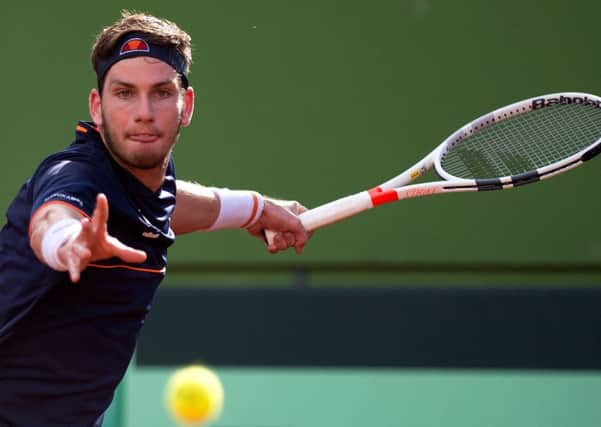British Cameron Norrie returns the ball to SpainÂ´s Spain's Albert Ramos during the first round of the Davis Cup tennis match between Spain and Great Britain at the Puente Romano tennis club in Marbella, on February 04, 2018.  / AFP PHOTO / JORGE GUERREROJORGE GUERRERO/AFP/Getty Images