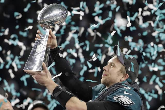 Philadelphia Eagles Nick Foles holds up the Vince Lombardi Trophy after Super Bowl 52 in which his team defeated the New England Patriots. Picture: AP