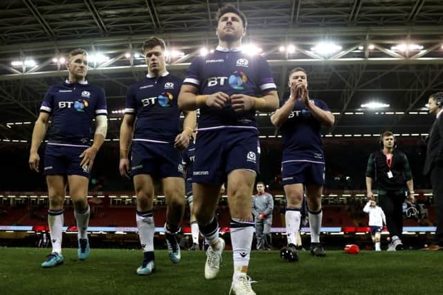 A dejected Scotland team leave the field at full-time after their 34-7 drubbing by Wales on Saturday. Picture: Getty.