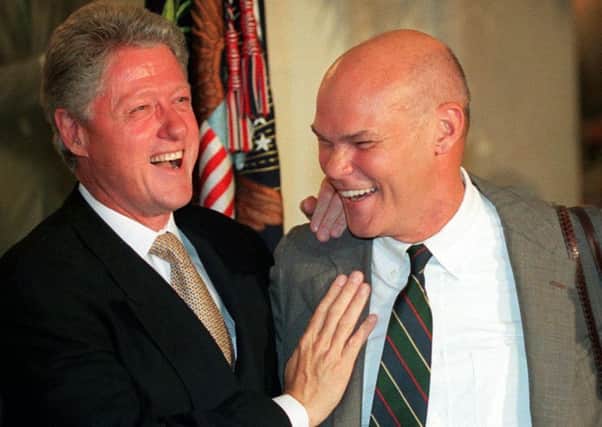 US President Bill Clinton and friend James Carville, who is believed to have come up with the campaign slogan, "It's the economy, stupid." (Picture: AFP/Getty)