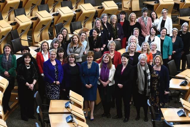 Female Scottish MSPs gathered at Holyrood to celebrate the 100th anniversary of women over 30 getting the vote. Picture: Lisa Ferguson