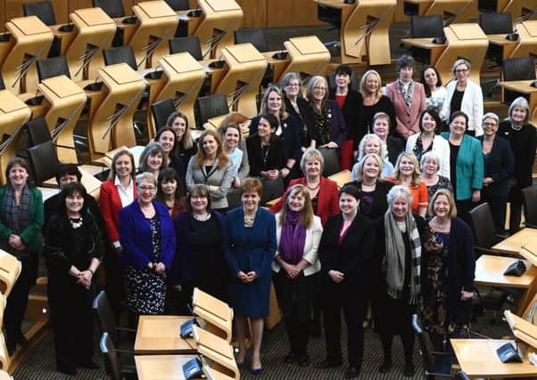 Female MSPs gather at Holyrood to mark the 100th anniversary of women first getting the vote. Picture: Lisa Ferguson