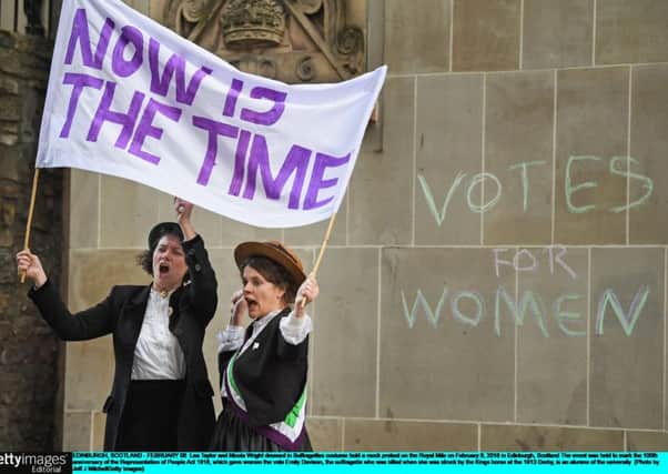 Lea Taylor and Nicola Wright dressed as Suffragettes hold a protest on the Royal Mile (Picture: Getty Images)