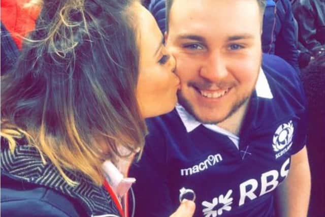 Kate and Kyle show off the ring while in the crowd at the Principality Stadium. Picture: Contributed/KateHarwood