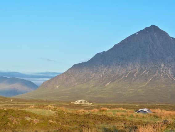 Campers in the shadow of Buachaille Etive Mor, at the entrance to Glen Etive.