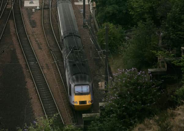 An east coast mainline train departs from Waverley station in Edinburgh