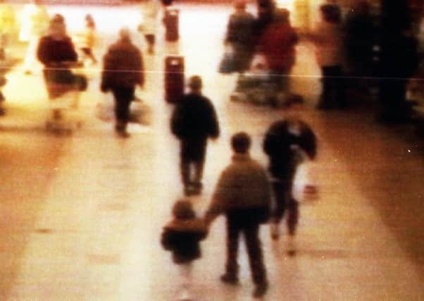 James Bulger is seen being led away on CCTV before his death in 1993. Picture: PA