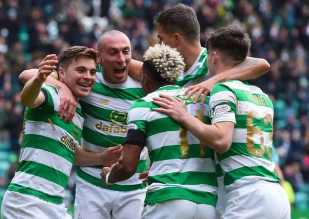 Celtic players celebrate after Forrest scores. Picture: SNS/Craig Foy