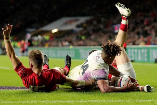Wales' Gareth Anscombe, left, claims for a try but it was ruled out after a referral to the TMO. Picture: Gareth Fuller/PA Wire