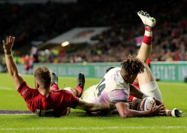 Wales' Gareth Anscombe, left, claims for a try but it was ruled out after a referral to the TMO. Picture: Gareth Fuller/PA Wire