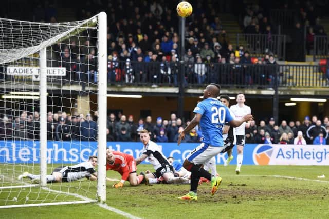 Alfredo Morelos somehow scoops his effort over the bar. Picture: SNS