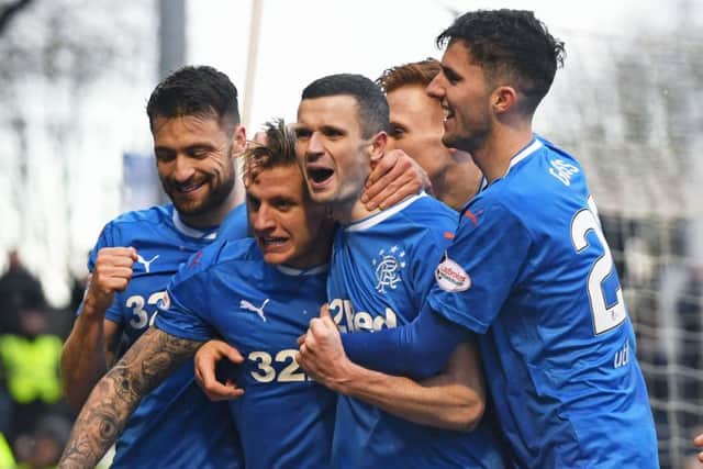 Rangers players celebrate after Jason Cummings, second left, puts the visitors in front. Picture: SNS