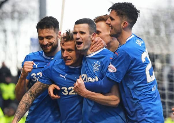 Rangers players celebrate after Jason Cummings, second left, puts the visitors in front. Picture: SNS