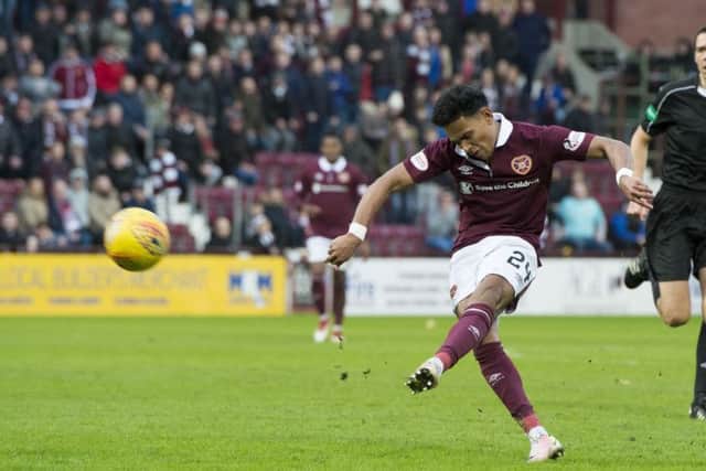 Hearts full-back Deme Mitchell dinks an unstoppable lofted shot into the postage stamp for the first goal of his senior career. Picture: SNS.