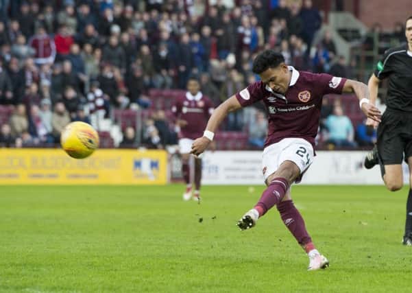 Hearts full-back Deme Mitchell dinks an unstoppable lofted shot into the postage stamp for the first goal of his senior career. Picture: SNS.