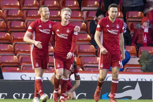 Gary Mackay-Steven, centre, celebrates after scoring against his old club. Picture: SNS