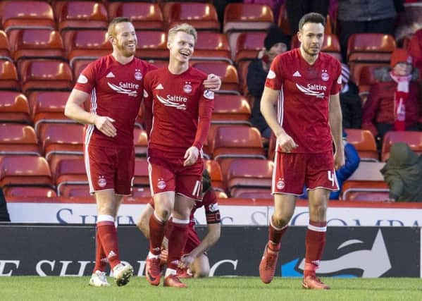 Gary Mackay-Steven, centre, celebrates after scoring against his old club. Picture: SNS
