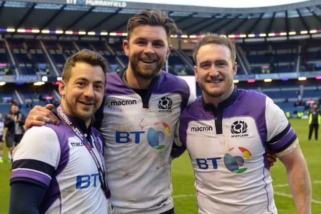 Scotland's Greig Laidlaw, Ryan Wilson and Stuart Hogg after full-time. Picture: SNS