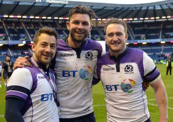 Scotland's Greig Laidlaw, Ryan Wilson and Stuart Hogg after full-time. Picture: SNS
