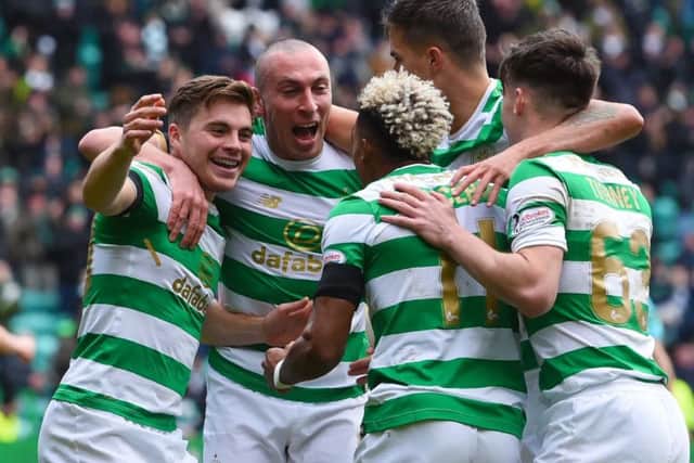 James Forrest, far left, celebrates with team-mates after completing his hat-trick against Partick Thistle. Picture: SNS.