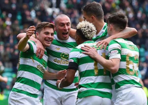 James Forrest, far left, celebrates with team-mates after completing his hat-trick against Partick Thistle. Picture: SNS.