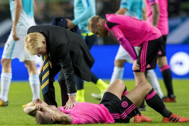 Gordon Strachan consoles Leigh Griffiths after the 2-2 draw against Slovenia ended Scotland's hopes of reaching the World Cup finals in Russia this summer.
