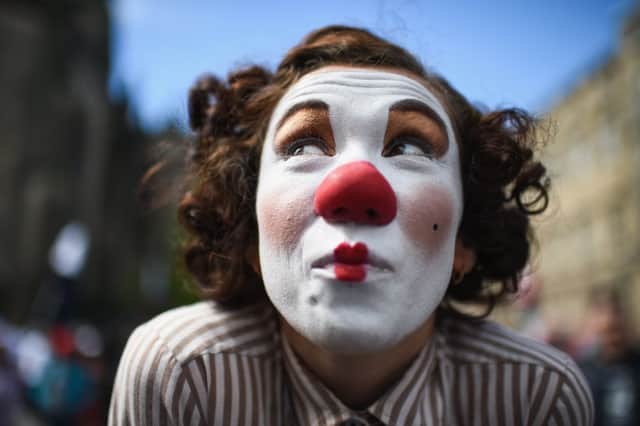 A Fringe entertainer performs on the Royal Mile in 2017. Picture: Jeff J Mitchell/Getty
