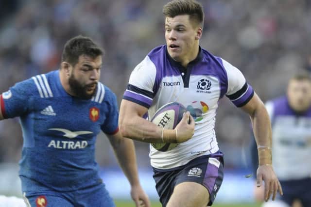Scotland's Huw Jones races through against France. Picture: Neil Hanna