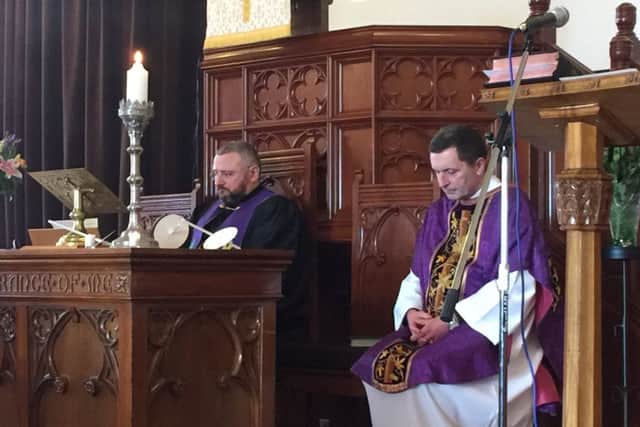 The ecumenical service was led by the Rev. Brian Casey (left) and Father John McGrath.