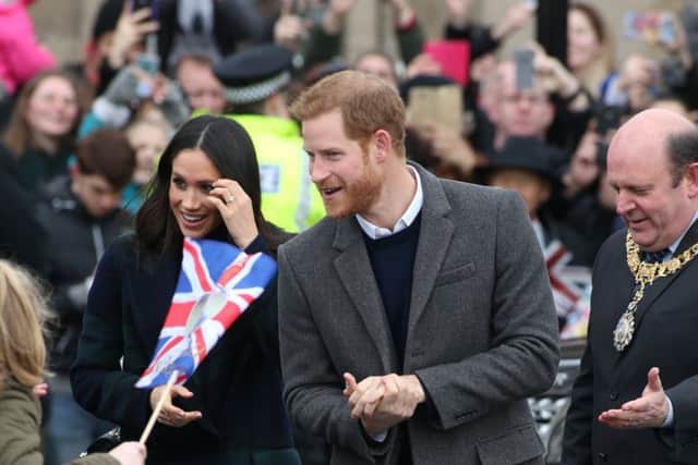 Prince Harry and Meghan Markle at Edinburgh Castle for their first official joint visit to Scotland. Picture; SWNS
