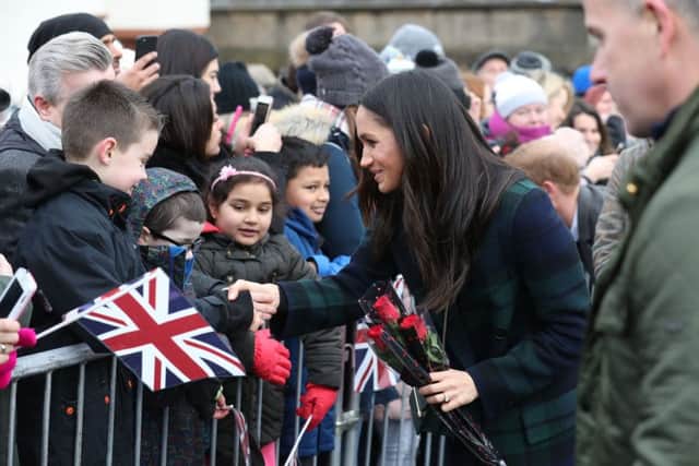 Meghan Markle during a walkabout on the esplanade at Edinburgh Castle, during their visit to Scotland. Picture: PA