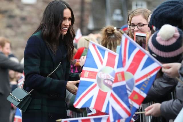 Meghan Markle during a walkabout on the esplanade at Edinburgh Castle, during their visit to Scotland. Picture: Andrew Milligan/PA Wire
