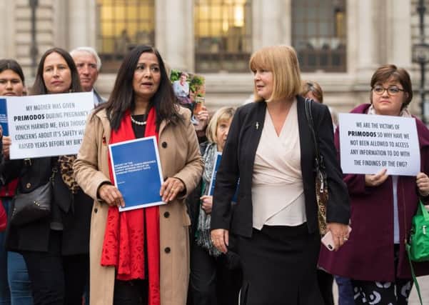 Yasmin Qureshi MP (fourth from left) and Marie Lyon, chair of the Association for Children Damaged by Hormone Pregnancy Tests (second from right), and campaigners who believe children suffered deformities as a result of the now-disused pregnancy test Primodos.