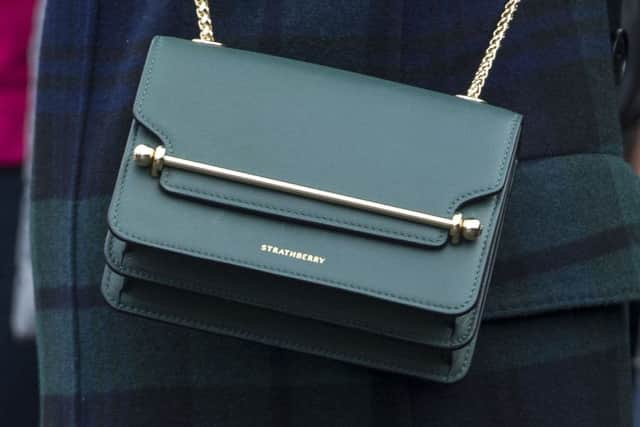 The handbag sported by Meghan Markle at Edinburgh Castle for their first official joint visit to Scotland. Pic; SWNS