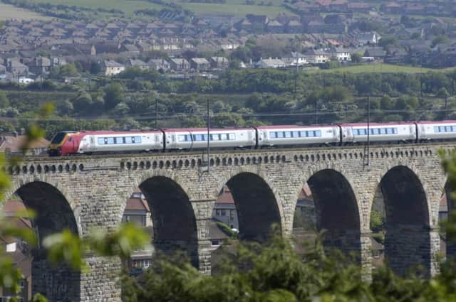 A Virgin train crossing the bridge into Berwick Upon Tweed on its way to Edinburgh