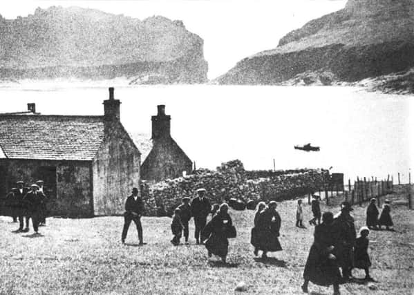 Locals leaving the church on Hirta, the main island in the archipelego of St Kilda, at the turn of the 20th Century. PIC: Donald Macleod/TSPL.