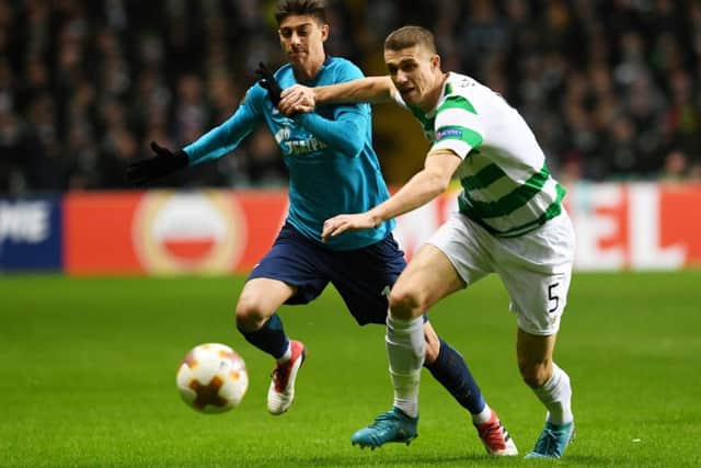 Celtic's Jozo Simunovic holds off Zenit's Emiliano Rigoni. Picture: Craig Foy/SNS