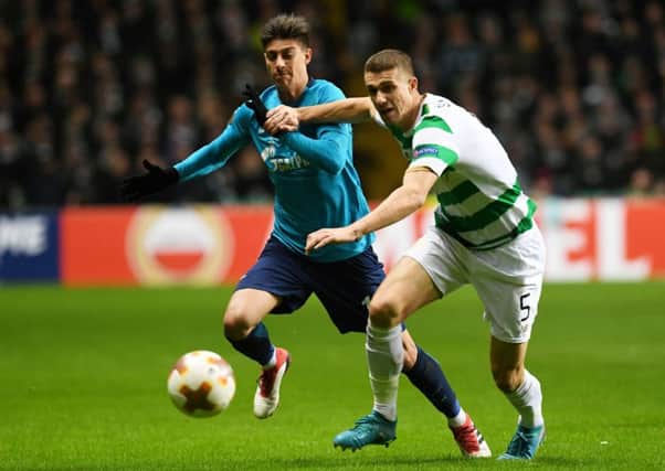 Celtic's Jozo Simunovic holds off Zenit's Emiliano Rigoni. Picture: Craig Foy/SNS