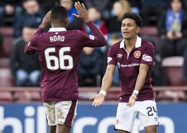 Hearts' Demetri Mitchell celebrates his goal against St Johnstone with Joaquim Adao. Picture: Ross Parker/SNS
